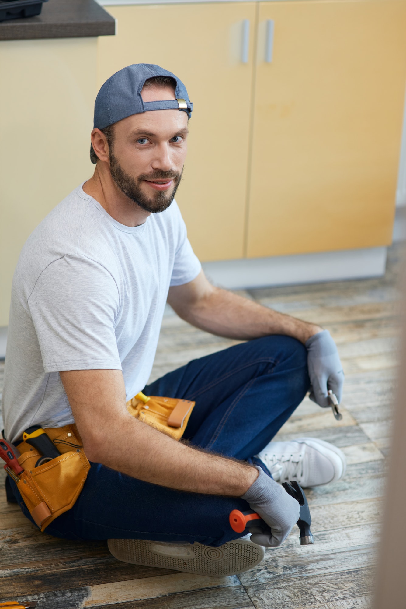 full-length-shot-of-young-repairman-looking-at-camera-holding-plumbing-tools-in-his-hands.jpg